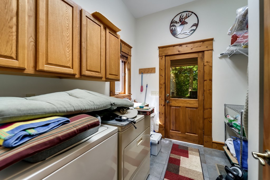 Laundry Room with utility sink and cabinets