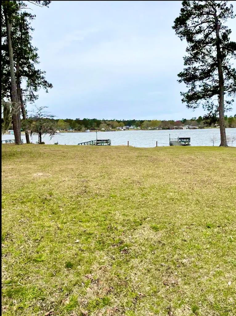Large yard, pier and boat ramp 