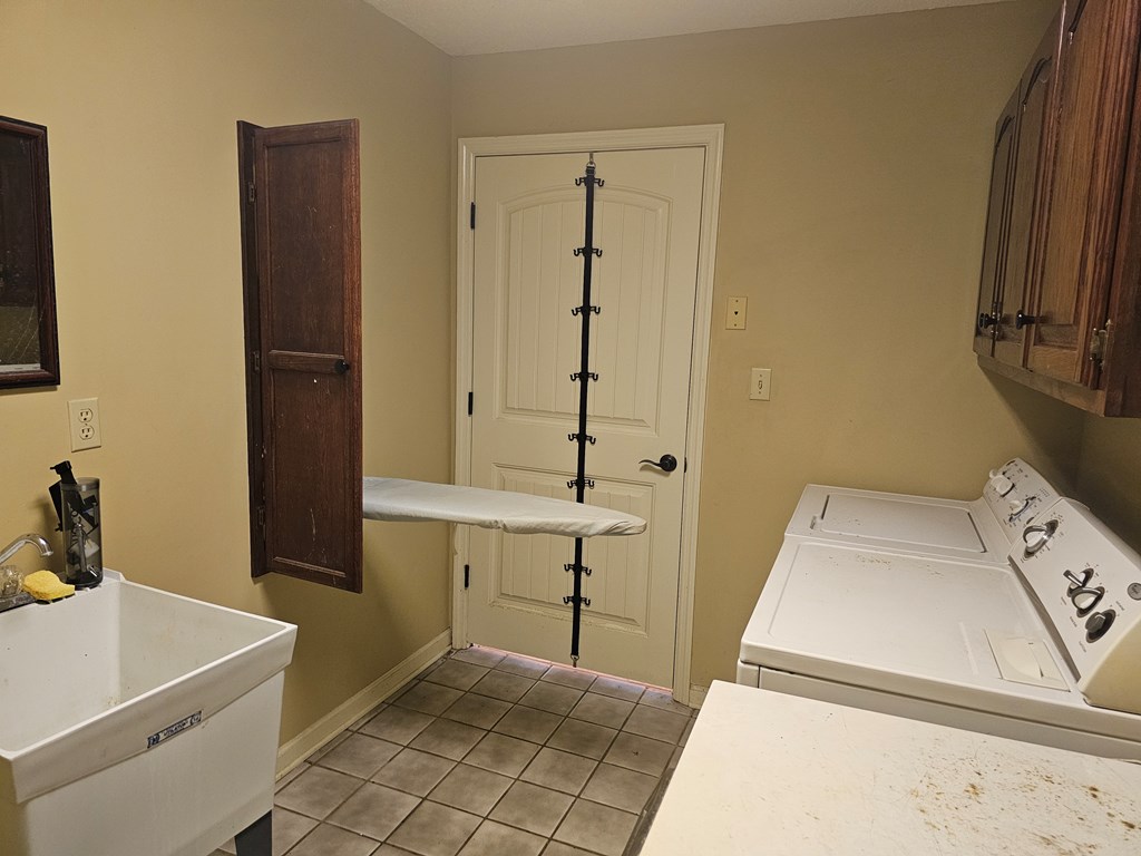 Laundry room with built in Ironing board