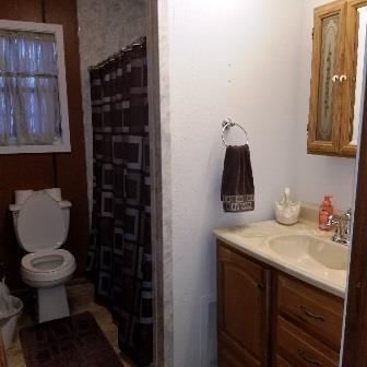 PRIMARY BATHROOM TUB AND COMMODE