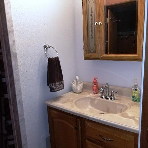 PRIMARY SINK AND MIRROR CABINET