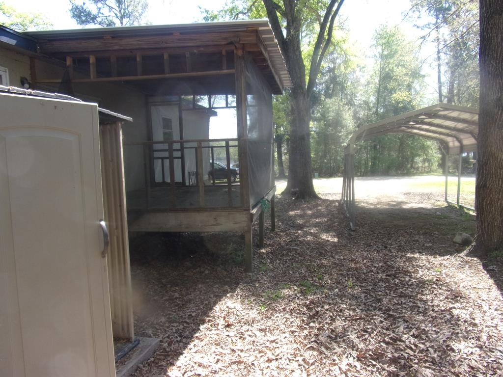 view of back screened in porch