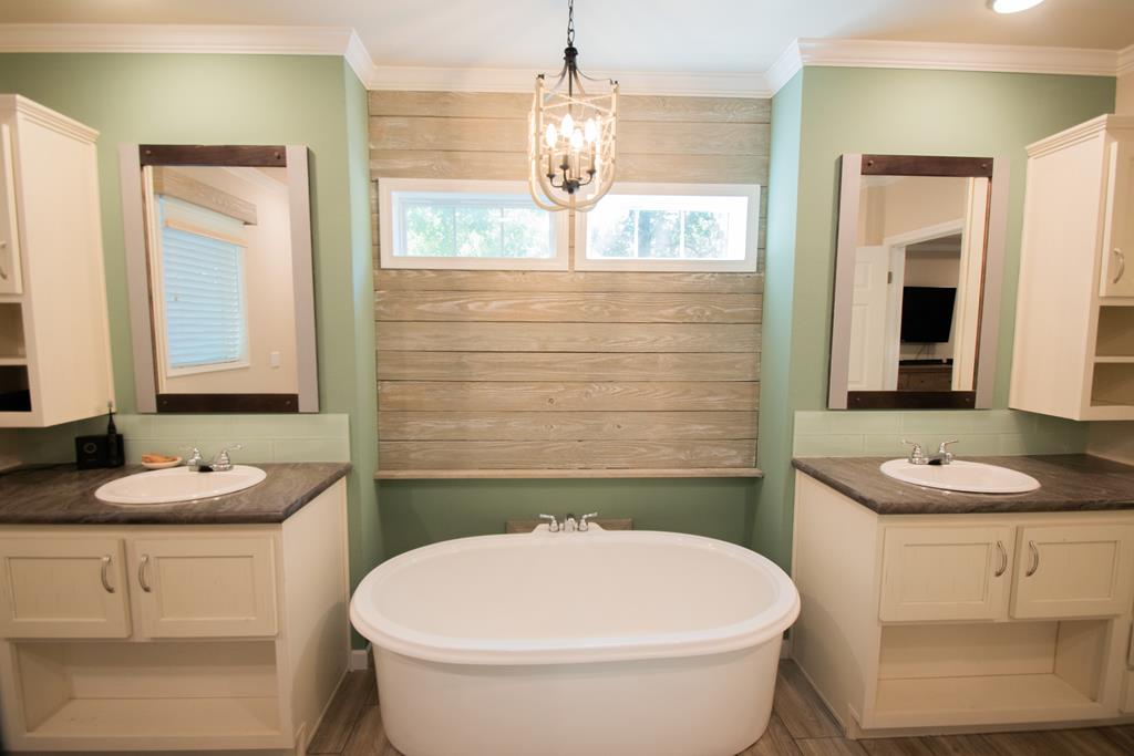 Master bath with tub and separate vanities
