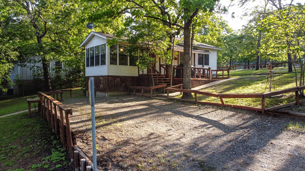 View of house from one of the two parking area and