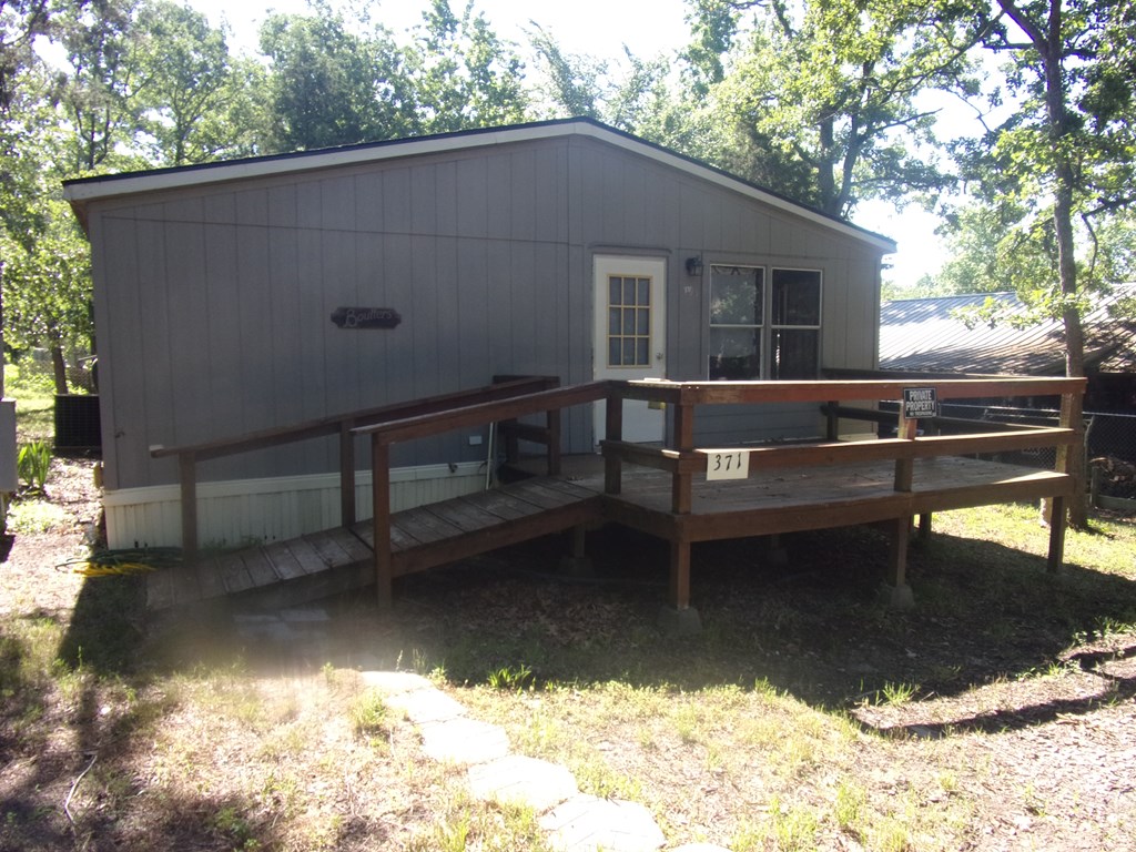Front of home with large deck/porch