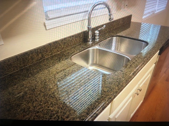 Stainless sink and granite countertops.