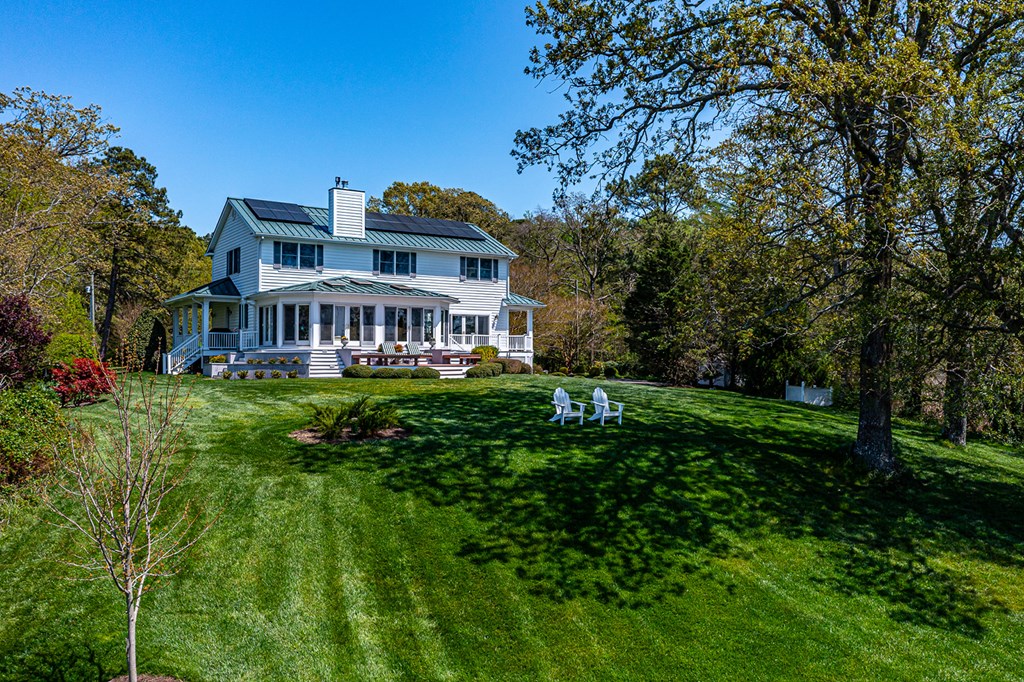 Home located on knoll overlooking river