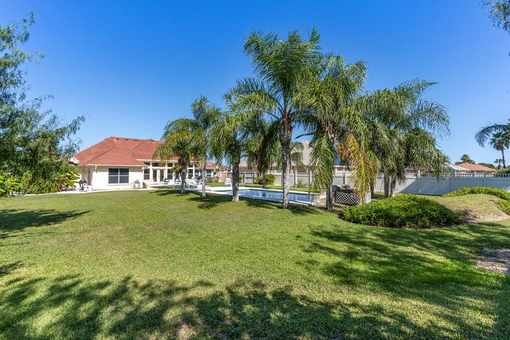 Large yard with a privacy fence