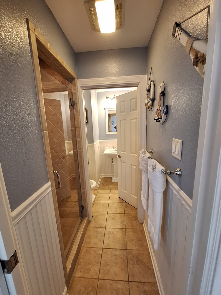 Guest bath accessed from guest bedroom