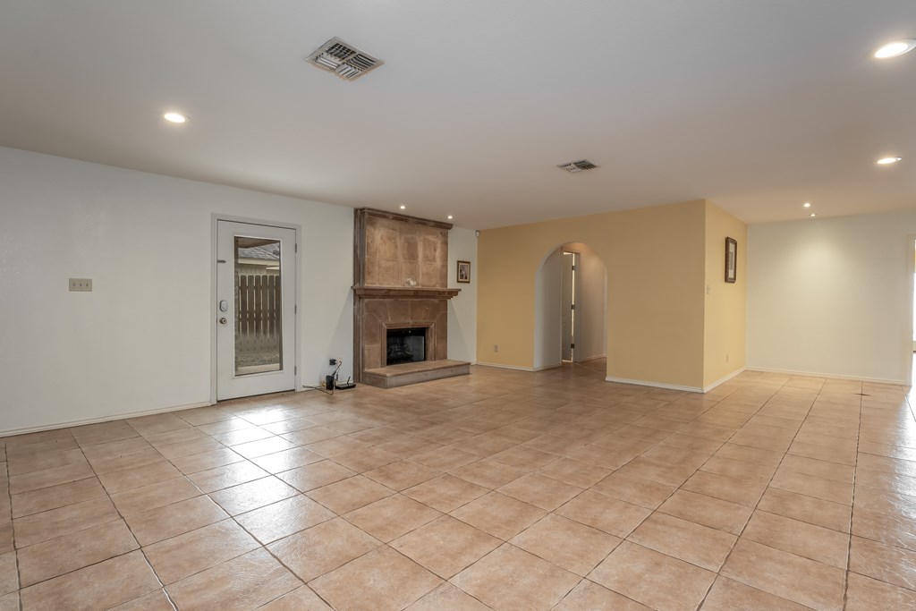 Fireplace in living room and Door to Backyard