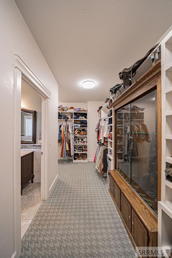 Primary Walk-in Closet with Washer and Dryer