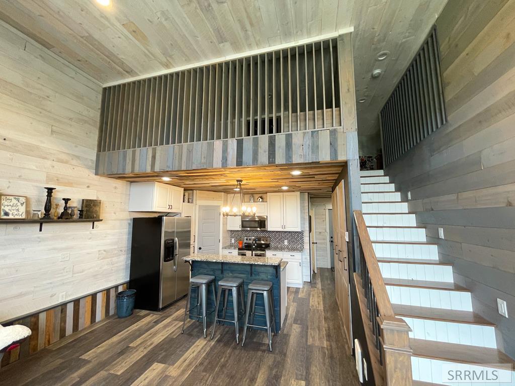 Looking toward kitchen and upstairs