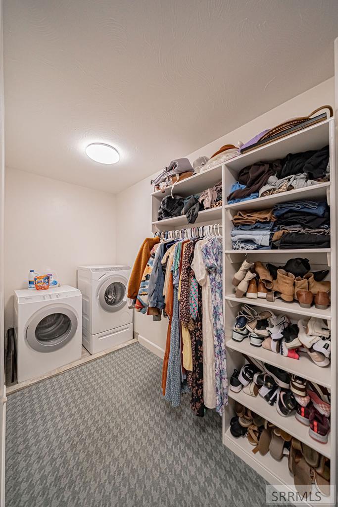 Primary Walk-in Closet with Washer and Dryer