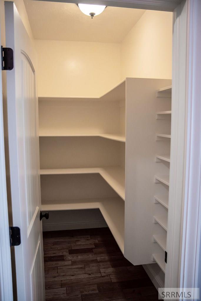 Walk in Pantry in hallway between garage and kitch