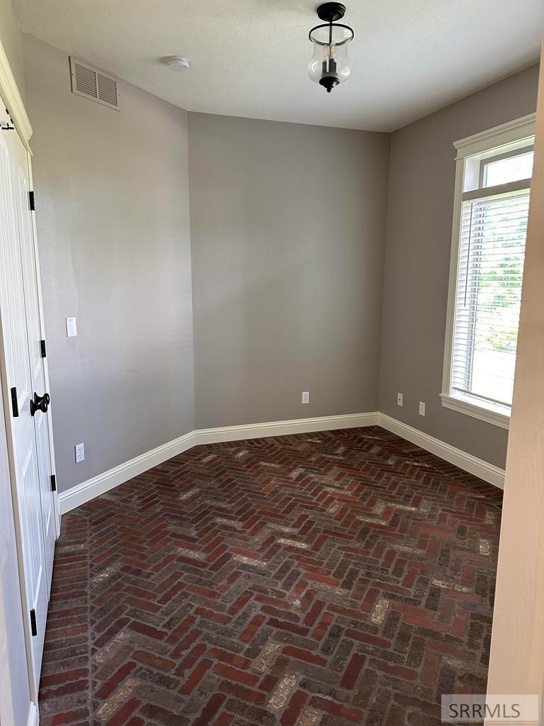 Close up of brick flooring in front office/bedroom