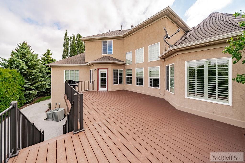 Large upper deck with staircase to yard