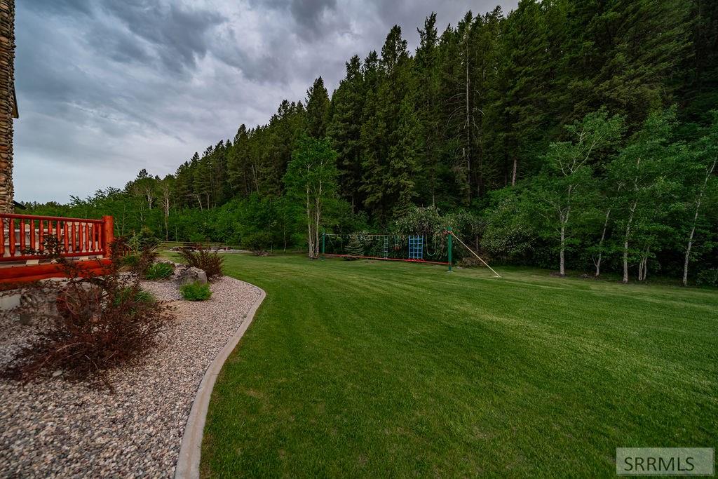 Nestled on 5.2 acres bordering national forest