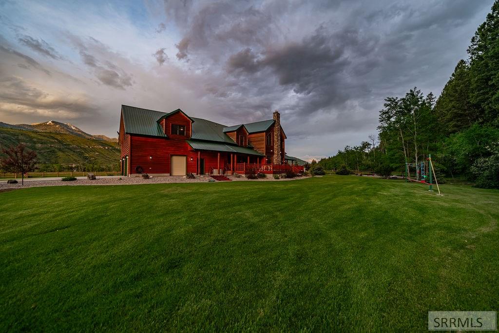 Nestled on 5.2 acres bordering national forest