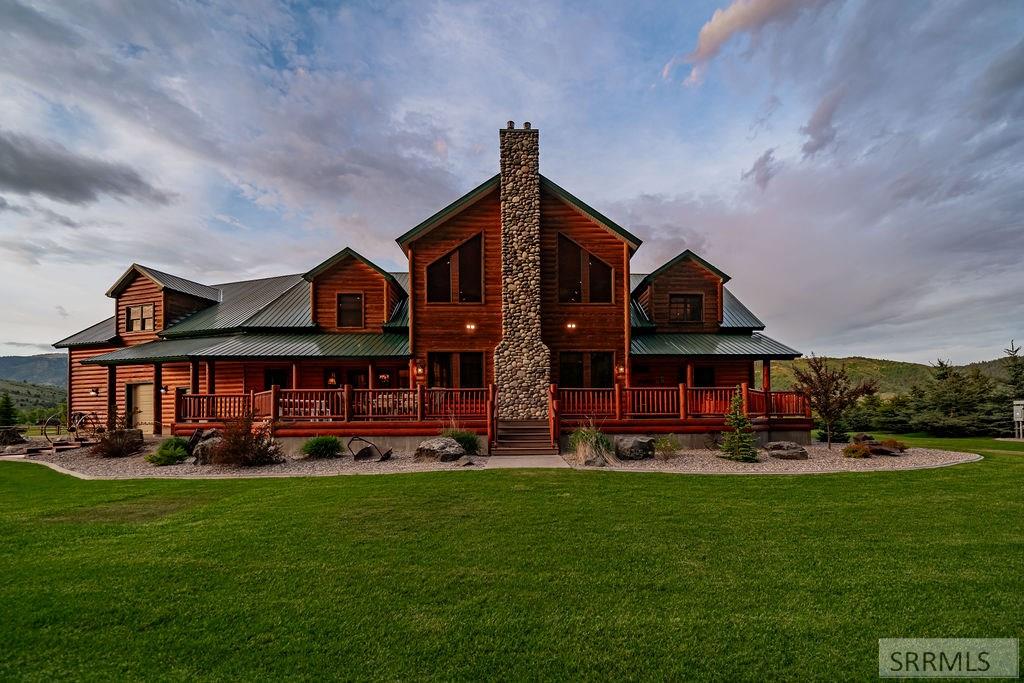 Nestled on 5.2 acres bordering national forest