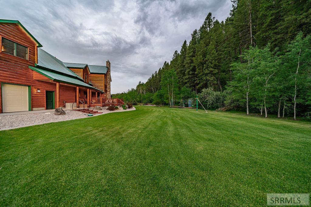 Nestled on 5.2 acres bordering national forest