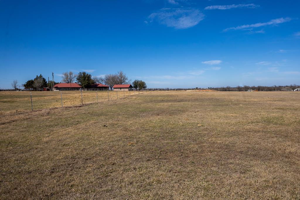 Land view of 70 ac tract with House looking north
