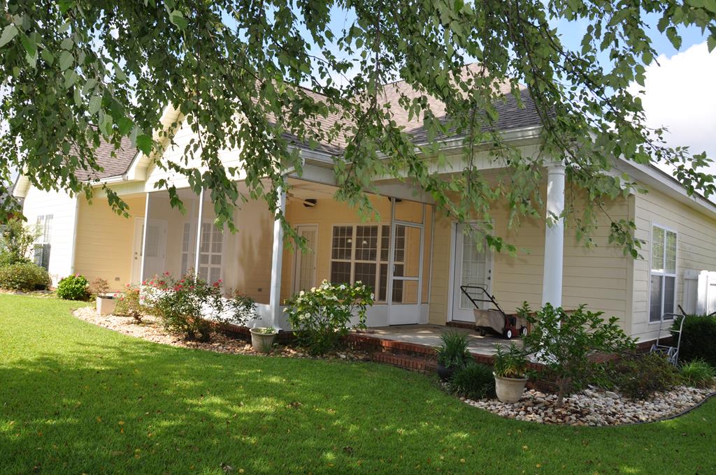 The screened in porch opens to both patios.