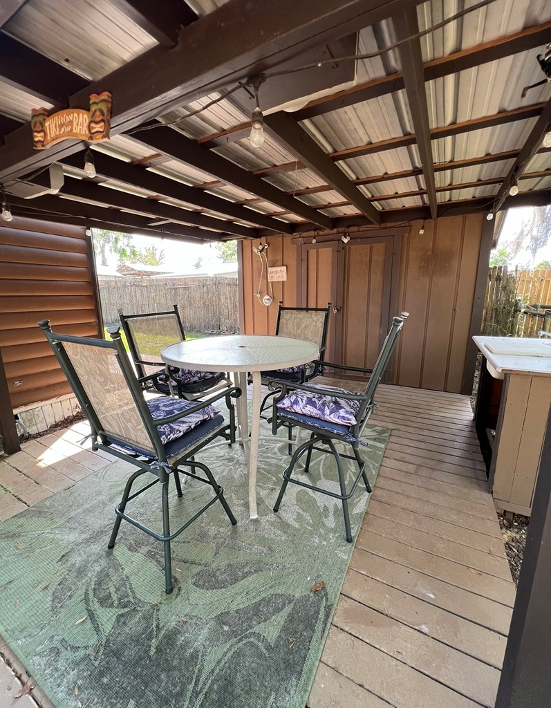 Outdoor seating area with fish cleaning station