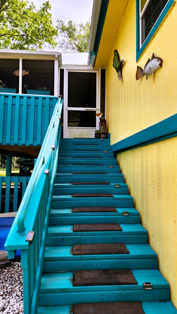 Stairs to Screen-in Porch with upstairs home