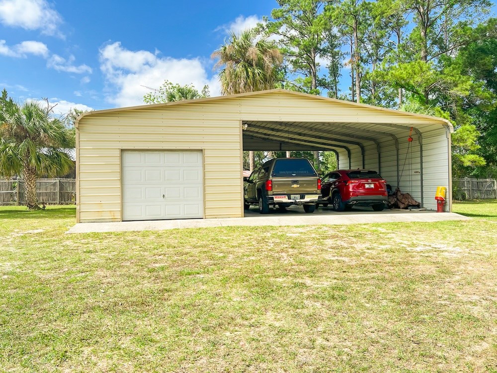 Large Enclosed Garage + 2-car Carport