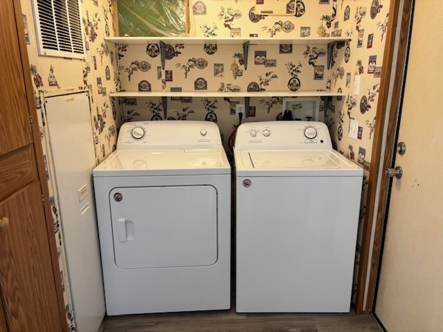 laundry room includes washer/dryer